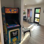 A nostalgic Ms. Pac-Man arcade cabinet tucked into a corner of the office for patient entertainment.
