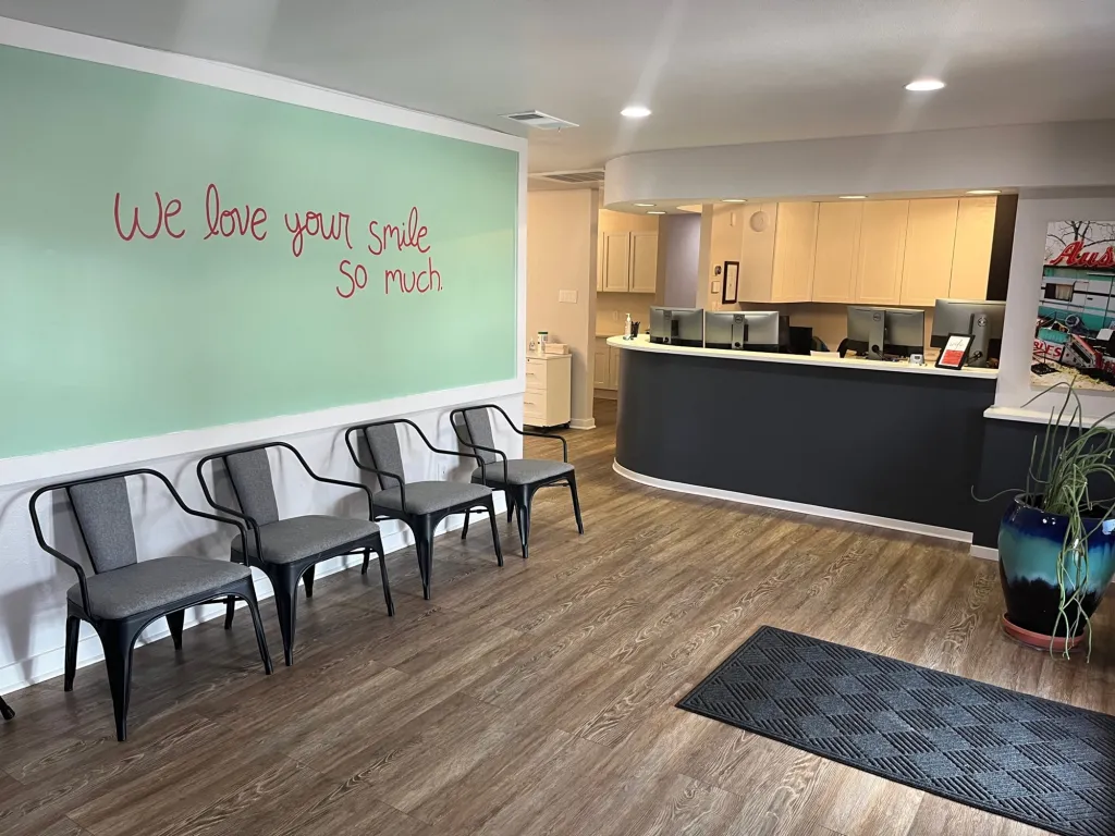 Waiting room inside Central Texas Orthodontics with We Love Your Smile so Much